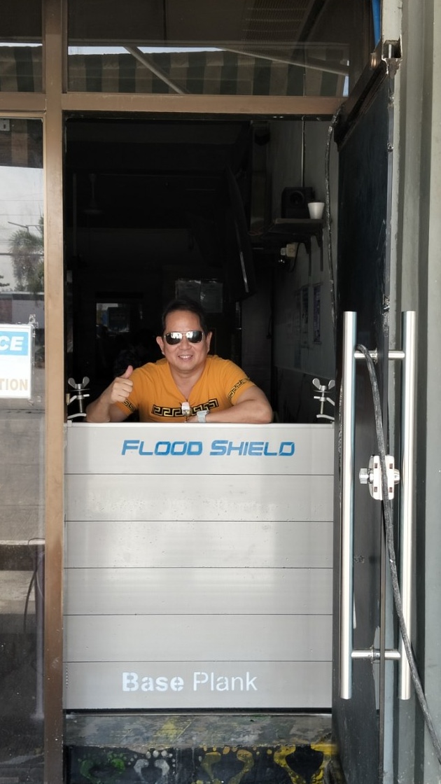 Commercial flood control barrier at a business entrance.