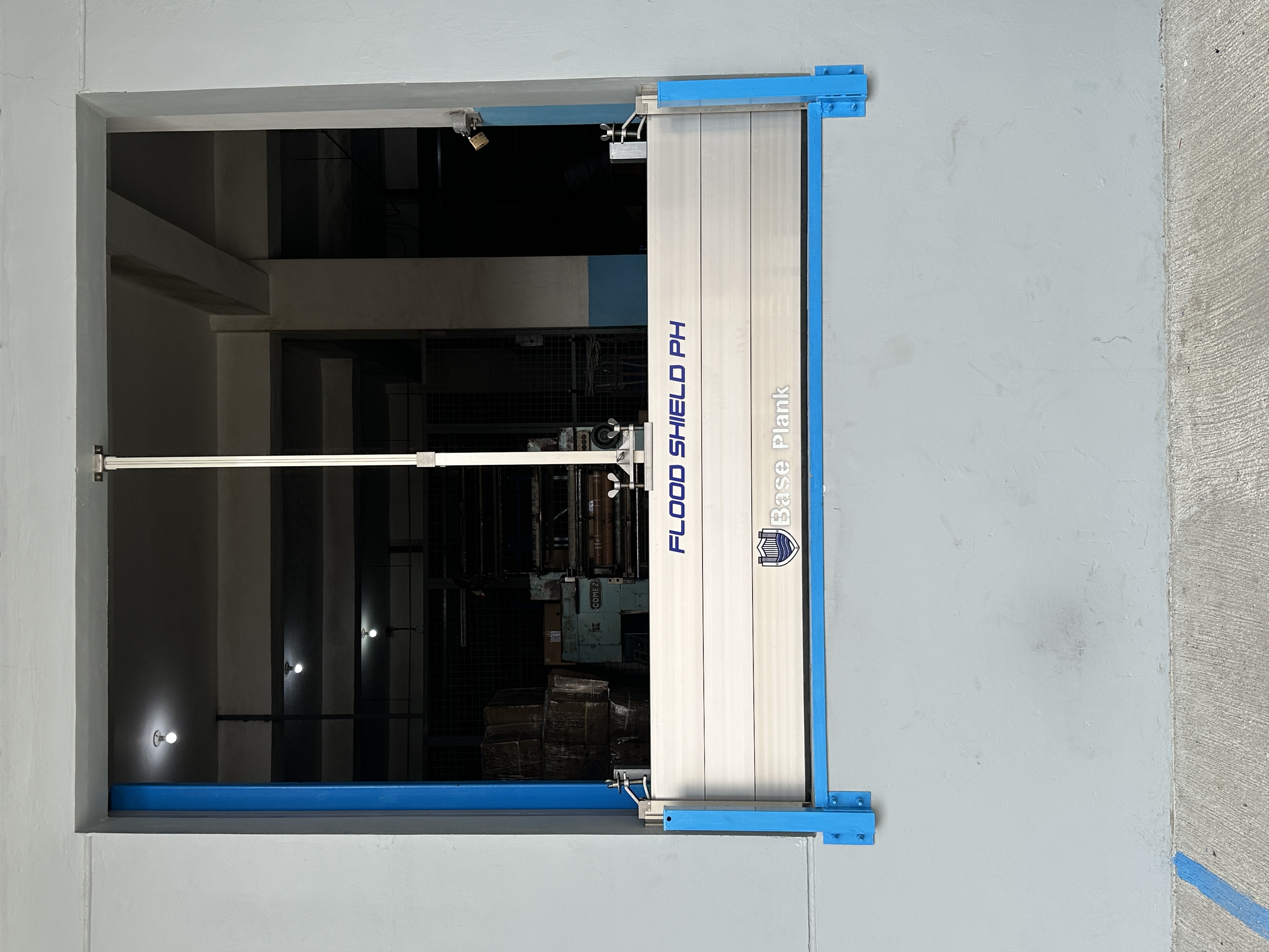 Industrial flood barrier protecting a warehouse facility in the Philippines.